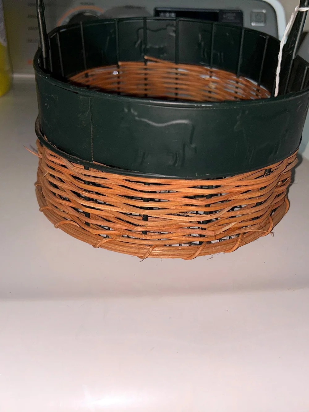vintage oval gathering basket with a dark green metal frame.